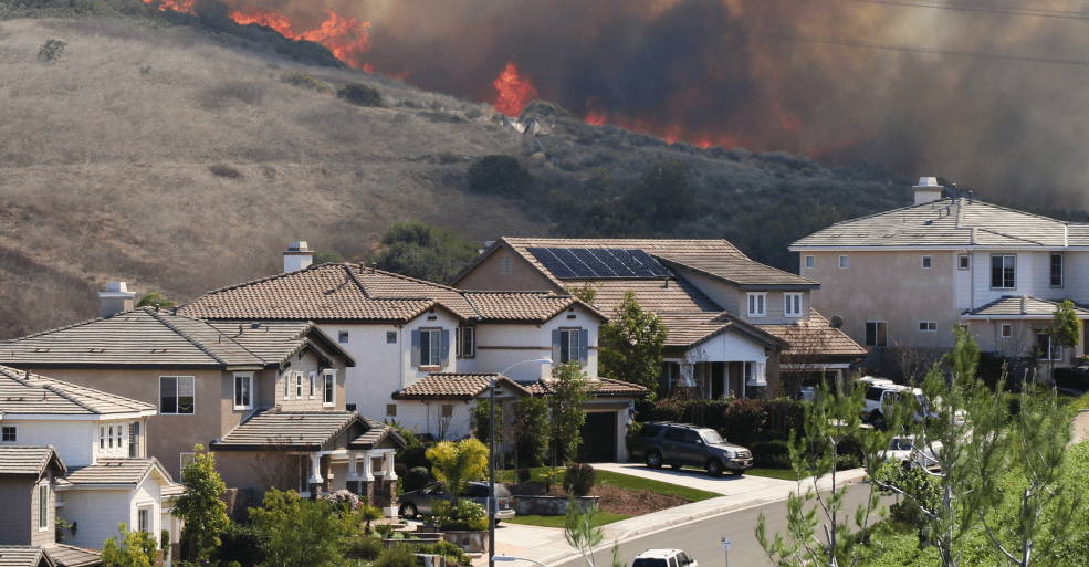 Wildfire approaching home with solar panels