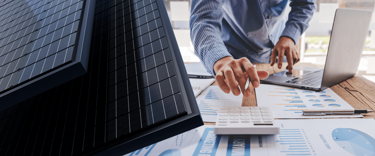 hands typing on a calculator